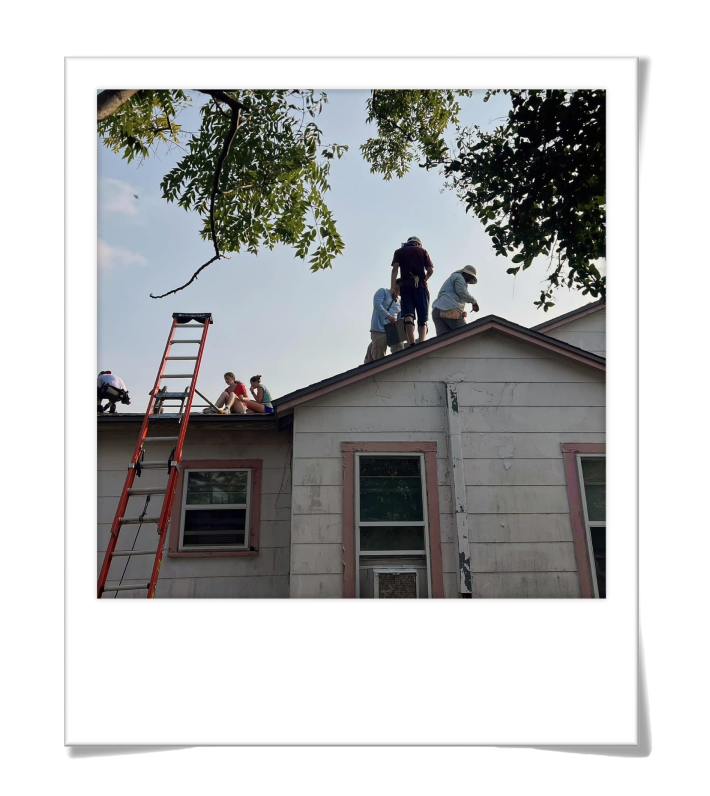 Youth helping on roofing